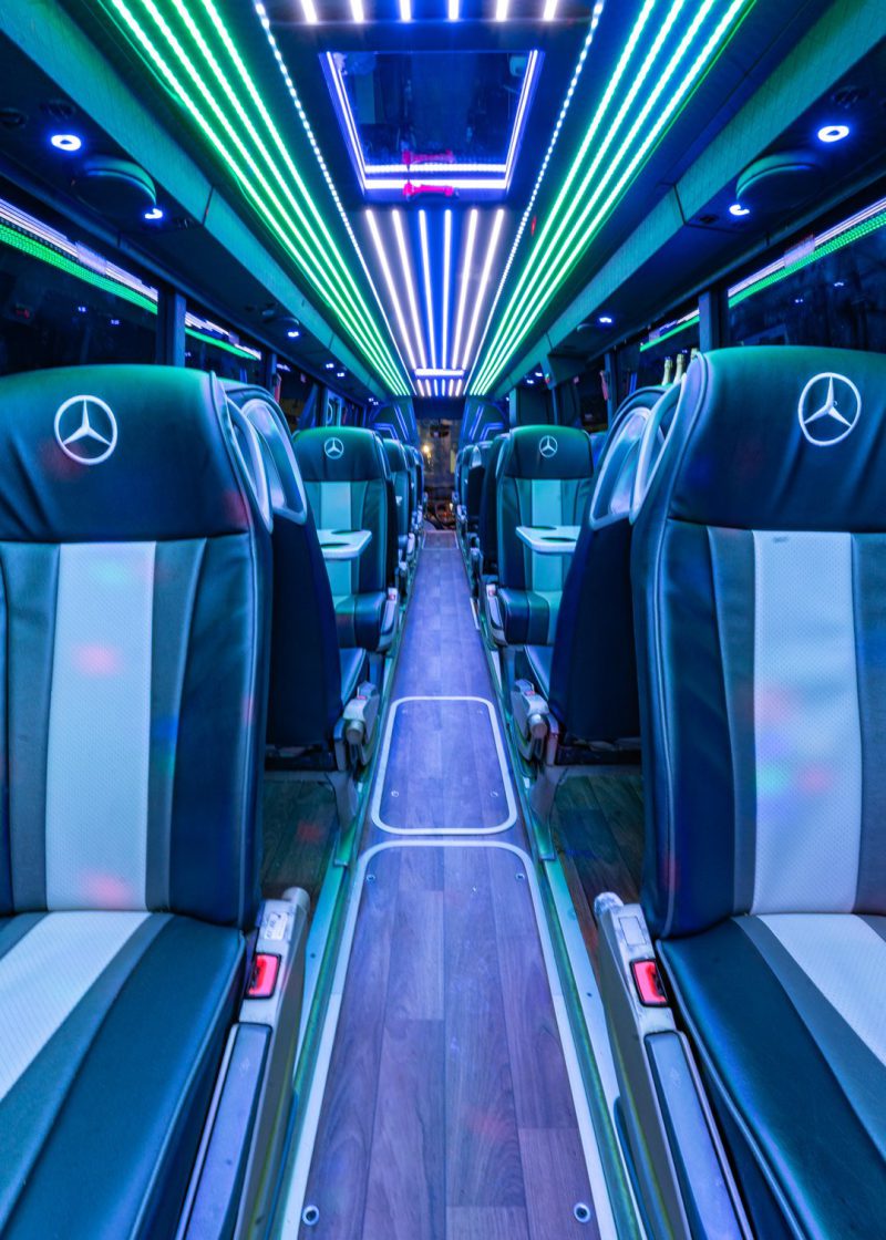 VIP Buses Mercedes Turismo 41 Seater Coach aisle rearward with a wood floor and green LEDs