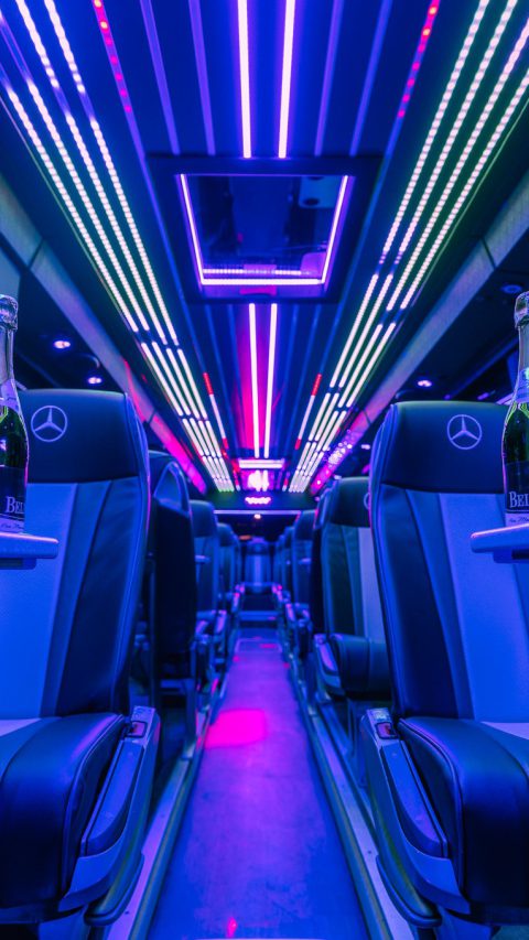 VIP Buses Mercedes Turismo 41 Seater Coach christmas pub crawl interior at night with champagne on the tables