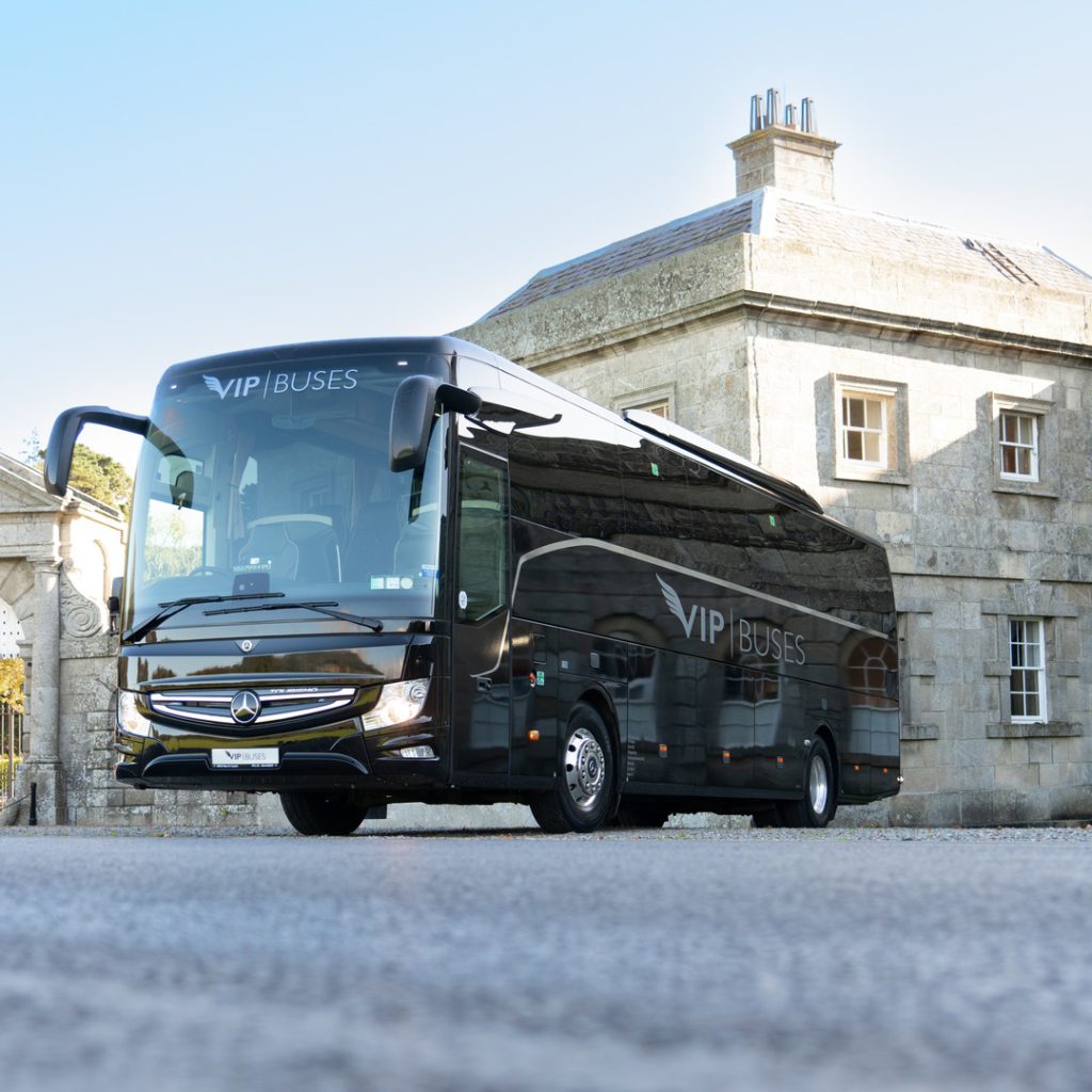 VIP Buses Mercedes Turismo 41 Seater Coach framed in the estate gate arch from the drive