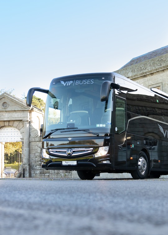 VIP Buses Mercedes Turismo 41 Seater Coach framed in the estate gate arch from the drive