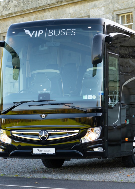 VIP Buses Mercedes Turismo 41 Seater Coach front three quarter on the gravel with the house behind