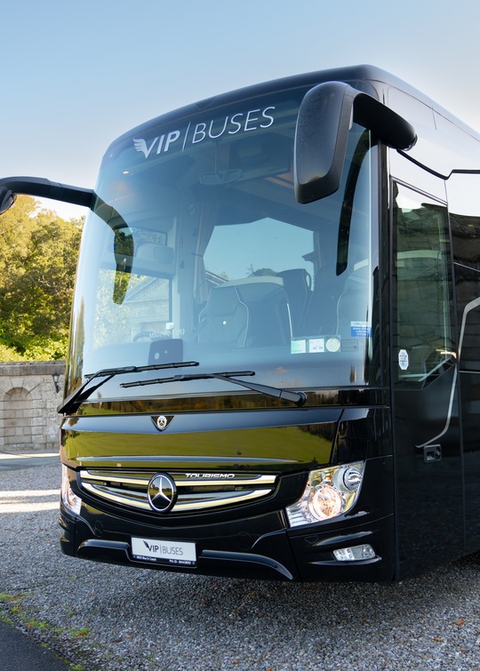 VIP Buses Mercedes Turismo 41 Seater Coach front three quarter with an obelisk on the lawn behind