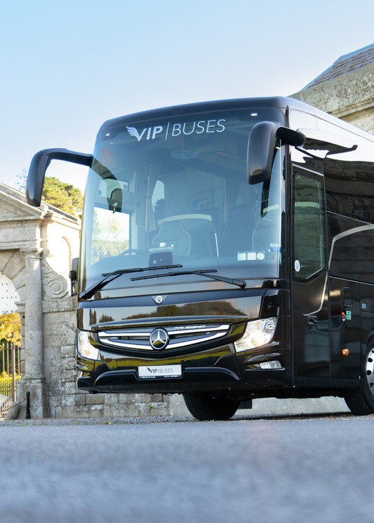 VIP Buses Mercedes Turismo 41 Seater Coach passing under the stone arch of the estate gateway