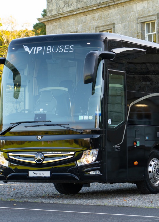 VIP Buses Mercedes Turismo 41 Seater Coach side profile on the drive with parkland behind