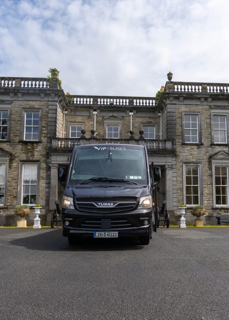 VIP Buses Turas 33 Seater Coach head on centred in front of the country house facade